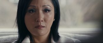 Movie still from “Hustlers” (2019), directed by Lorene Scafaria – A person with a tear in her eye; Close Up shot, High angle