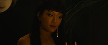 Movie still from “Hustlers” (2019), directed by Lorene Scafaria – A person wearing a necklace; Close Up shot, Over the shoulder angle