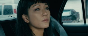 Movie still from “Hustlers” (2019), directed by Lorene Scafaria – A person sitting in a car; Close Up shot, High angle