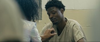 Movie still from “Hustlers” (2019), directed by Lorene Scafaria – A man and a woman are looking at one another; Close Up shot, Over the shoulder angle