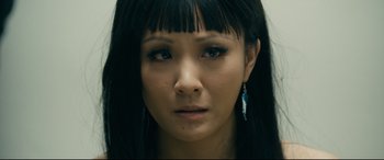 Movie still from “Hustlers” (2019), directed by Lorene Scafaria – A person with long black hair; Close Up shot, High angle