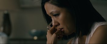 Movie still from “Hustlers” (2019), directed by Lorene Scafaria – A person talking on a cell phone; Close Up shot, High angle