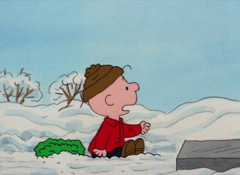 Movie still from “It's Christmastime Again, Charlie Brown” (1992), directed by Bill Melendez – Charlie brown sitting in the middle of a snowy field; Extreme Wide shot, High angle