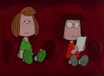 Movie still from “It's Christmastime Again, Charlie Brown” (1992), directed by Bill Melendez – A couple of people that are sitting on a couch; Wide shot, High angle