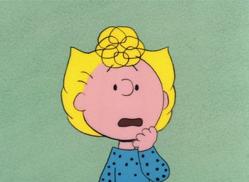 Movie still from “It's Christmastime Again, Charlie Brown” (1992), directed by Bill Melendez – A drawing of a girl with blonde hair and a blue shirt; Close Up shot, High angle