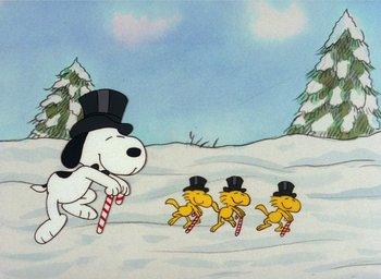 Movie still from “It's Christmastime Again, Charlie Brown” (1992), directed by Bill Melendez – A group of dogs running through the snow; Extreme Wide shot, Low angle