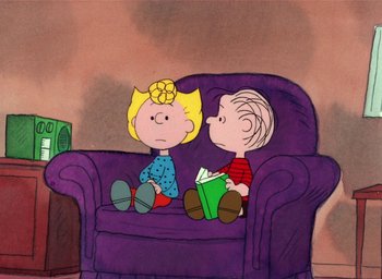 Movie still from “It's Christmastime Again, Charlie Brown” (1992), directed by Bill Melendez – A couple of people sitting on top of a purple couch; Extreme Wide shot, High angle