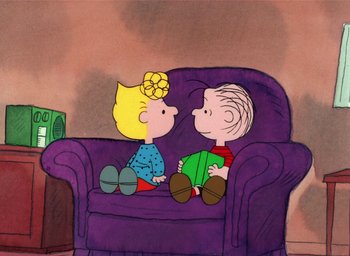 Movie still from “It's Christmastime Again, Charlie Brown” (1992), directed by Bill Melendez – A couple of people sitting on top of a purple couch; Wide shot, High angle