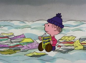 Movie still from “It's Christmastime Again, Charlie Brown” (1992), directed by Bill Melendez – A charlie brown character is sitting in the water; Wide shot, Overhead angle