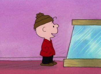 Movie still from “It's Christmastime Again, Charlie Brown” (1992), directed by Bill Melendez – A charlie brown character standing in front of a display case; Medium shot, Over the shoulder angle