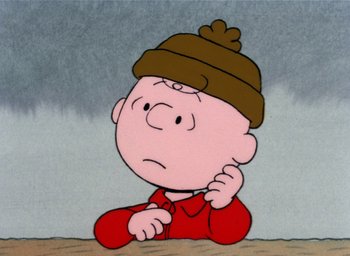 Movie still from “It's Christmastime Again, Charlie Brown” (1992), directed by Bill Melendez – A charlie brown cartoon character with a brown hat; Close Up shot, High angle