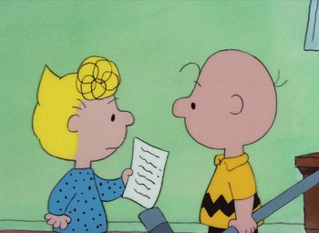 Movie still from “It's Christmastime Again, Charlie Brown” (1992), directed by Bill Melendez – A charlie brown and a blond boy holding a paper together; Medium shot, High angle