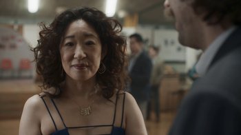 Movie still from “Killing Eve” (2018), created by Phoebe Waller-Bridge – A person wearing a necklace; Close Up shot, Over the shoulder angle
