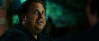 Movie still from “War Dogs” (2016), directed by Todd Phillips – A person looking up at the sky; Close Up shot, Over the shoulder angle