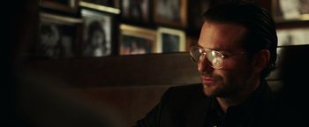 Movie still from “War Dogs” (2016), directed by Todd Phillips – A person wearing sunglasses; Close Up shot, Over the shoulder angle