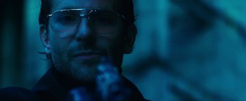 Movie still from “War Dogs” (2016), directed by Todd Phillips – A man wearing glasses; Close Up shot, Low angle