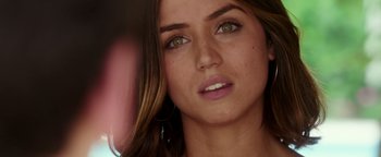 Movie still from “War Dogs” (2016), directed by Todd Phillips – A woman's face with green eyes; Close Up shot, Over the shoulder angle