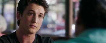 Movie still from “War Dogs” (2016), directed by Todd Phillips – A man's face in front of a window; Close Up shot, Over the shoulder angle