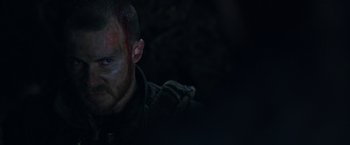 Movie still from “War for the Planet of the Apes” (2017), directed by Matt Reeves – A person with blood on his face; Close Up shot, Over the shoulder angle