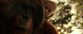 Movie still from “War for the Planet of the Apes” (2017), directed by Matt Reeves – A young girl standing next to a stuffed monkey; Close Up shot, Low angle