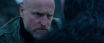 Movie still from “War for the Planet of the Apes” (2017), directed by Matt Reeves – A person with a beard; Close Up shot, Over the shoulder angle