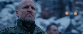 Movie still from “War for the Planet of the Apes” (2017), directed by Matt Reeves – A man with a goatee is looking up at the sky; Close Up shot, Low angle