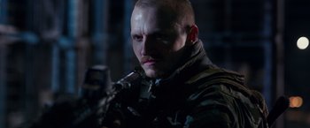 Movie still from “War for the Planet of the Apes” (2017), directed by Matt Reeves – A person holding a gun; Close Up shot, Low angle