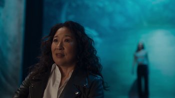 Movie still from “Killing Eve” (2018), created by Phoebe Waller-Bridge – A person with long hair; Medium shot, Over the shoulder angle