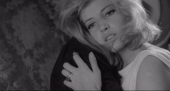 Movie still from “L'Eclisse” (1962), directed by Michelangelo Antonioni – A beautiful woman with a ring on her shoulder; Close Up shot, High angle