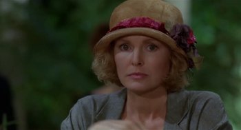 Movie still from “L.A. Story” (1991), directed by Mick Jackson – A person wearing a hat; Close Up shot, Over the shoulder angle