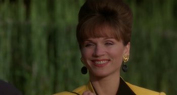 Movie still from “L.A. Story” (1991), directed by Mick Jackson – A person wearing a yellow jacket; Close Up shot, Low angle