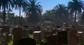 Movie still from “L.A. Story” (1991), directed by Mick Jackson – A cemetery with a gazebo in the background; Extreme Wide shot, High angle