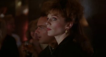 Movie still from “L.A. Story” (1991), directed by Mick Jackson – A woman in a black shirt and a man in a black suit; Close Up shot, Low angle