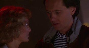 Movie still from “L.A. Story” (1991), directed by Mick Jackson – A man and a woman looking at each other; Close Up shot, Over the shoulder angle