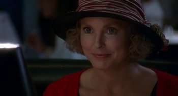 Movie still from “L.A. Story” (1991), directed by Mick Jackson – A person wearing a hat; Close Up shot, Over the shoulder angle