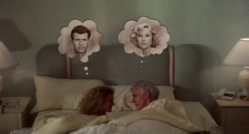 Movie still from “L.A. Story” (1991), directed by Mick Jackson – A man and a woman laying in a bed; Medium shot, Overhead angle