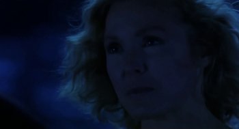 Movie still from “L.A. Story” (1991), directed by Mick Jackson – A person's face in the dark; Close Up shot, Low angle