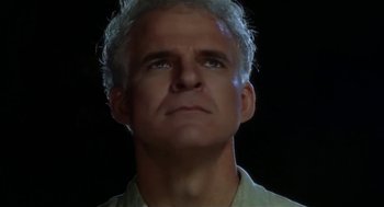 Movie still from “L.A. Story” (1991), directed by Mick Jackson – A person with a white hair; Close Up shot, Low angle