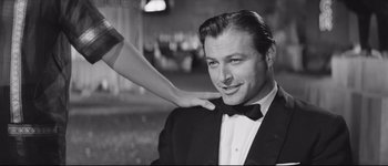 Movie still from “La Dolce Vita” (1960), directed by Federico Fellini – A man in a suit and a woman in a black dress; Close Up shot, Over the shoulder angle