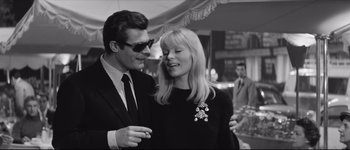 Movie still from “La Dolce Vita” (1960), directed by Federico Fellini – A man and a woman standing next to each other; Close Up shot, Low angle