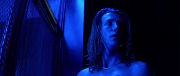 Movie still from “Nikita” (1990), directed by Luc Besson – A person with long dreadlocks; Close Up shot, Low angle