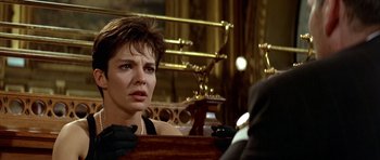 Movie still from “Nikita” (1990), directed by Luc Besson – A person sitting in front of a mirror; Close Up shot, Over the shoulder angle