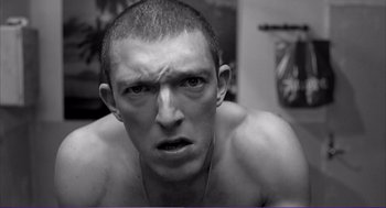 Movie still from “La haine” (1995), directed by Mathieu Kassovitz – A person with his mouth wide open; Close Up shot, Low angle