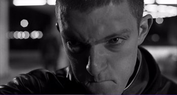 Movie still from “La haine” (1995), directed by Mathieu Kassovitz – A man's face in black and white; Close Up shot, Low angle