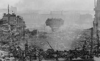 Movie still from “La Jetée” (1962), directed by Chris Marker – An image of a large amount of trash in a city; Extreme Wide shot, High angle