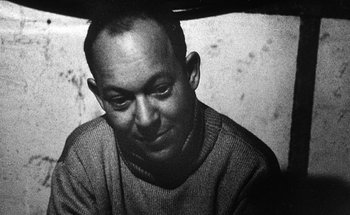 Movie still from “La Jetée” (1962), directed by Chris Marker – Black and white photograph of a man in a sweater; Close Up shot, Low angle