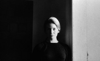 Movie still from “La Jetée” (1962), directed by Chris Marker – A woman standing in front of a window; Close Up shot, Low angle