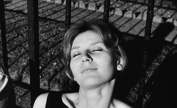 Movie still from “La Jetée” (1962), directed by Chris Marker – A black - and - white photo of a woman with her eyes closed; Close Up shot, Low angle