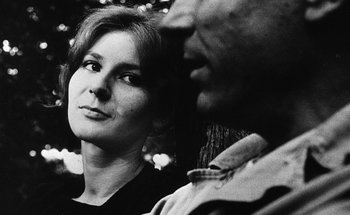Movie still from “La Jetée” (1962), directed by Chris Marker – A black and white photo of a woman and a man; Close Up shot, Low angle