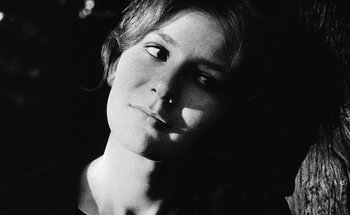 Movie still from “La Jetée” (1962), directed by Chris Marker – A black - and - white photo of a woman's face; Close Up shot, Low angle